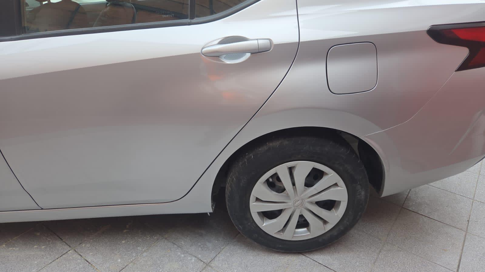 Resultado final de reparación en tapabarro y puerta trasera